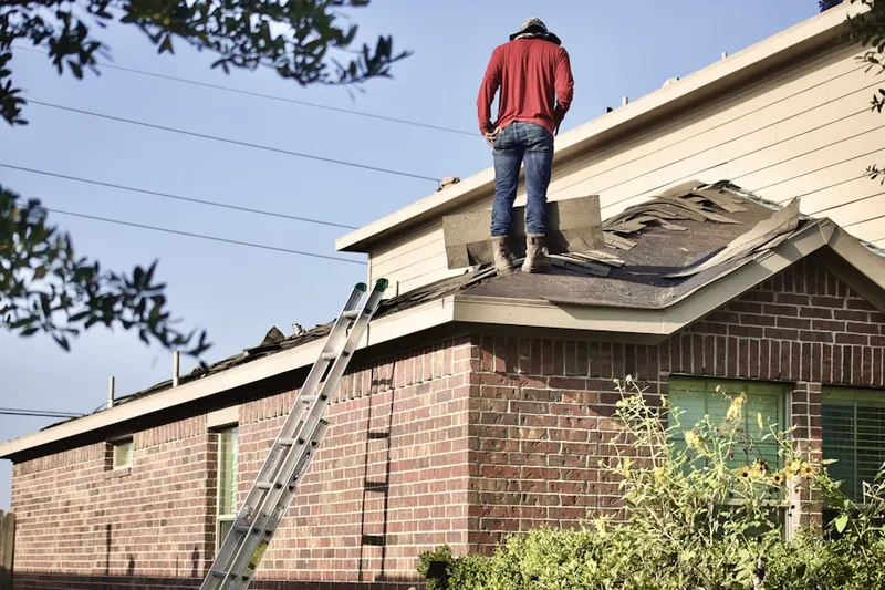 Professional roofer working on a residential roof in Islands of Doral